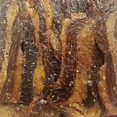 Close up image of LJ's Jerky Hot flavor.